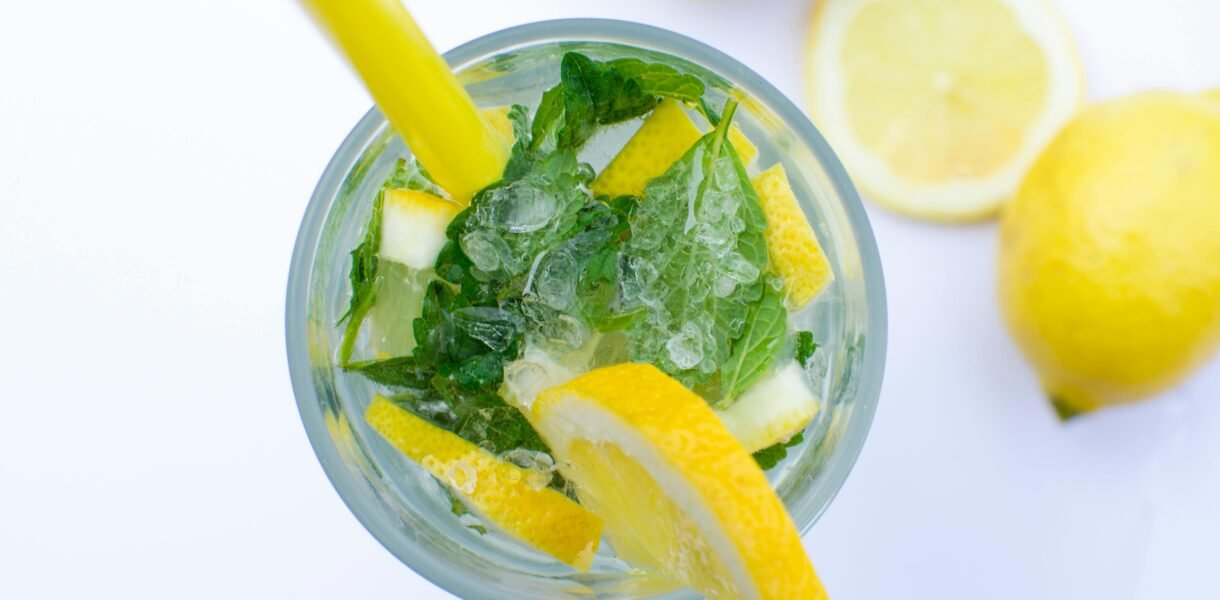 Flat Lay Photograph of Highball Glass With Sliced Lemon